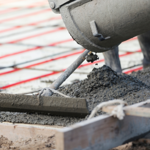 Concrete being poured and leveled
